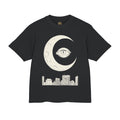 Night Shift Tee front, cream crescent moon eye over a city skyline on black
