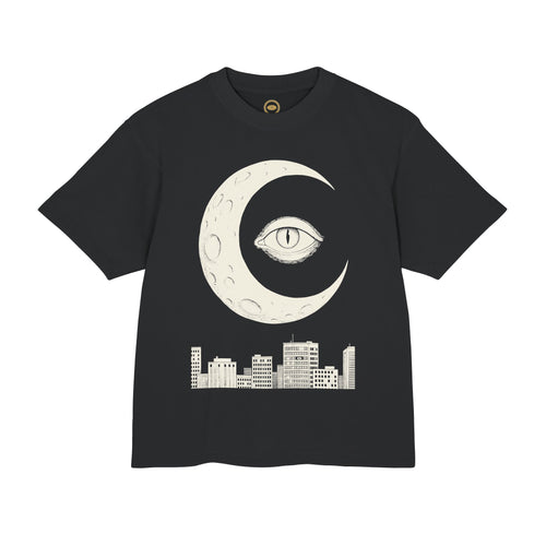 Night Shift Tee front, cream crescent moon eye over a city skyline on black