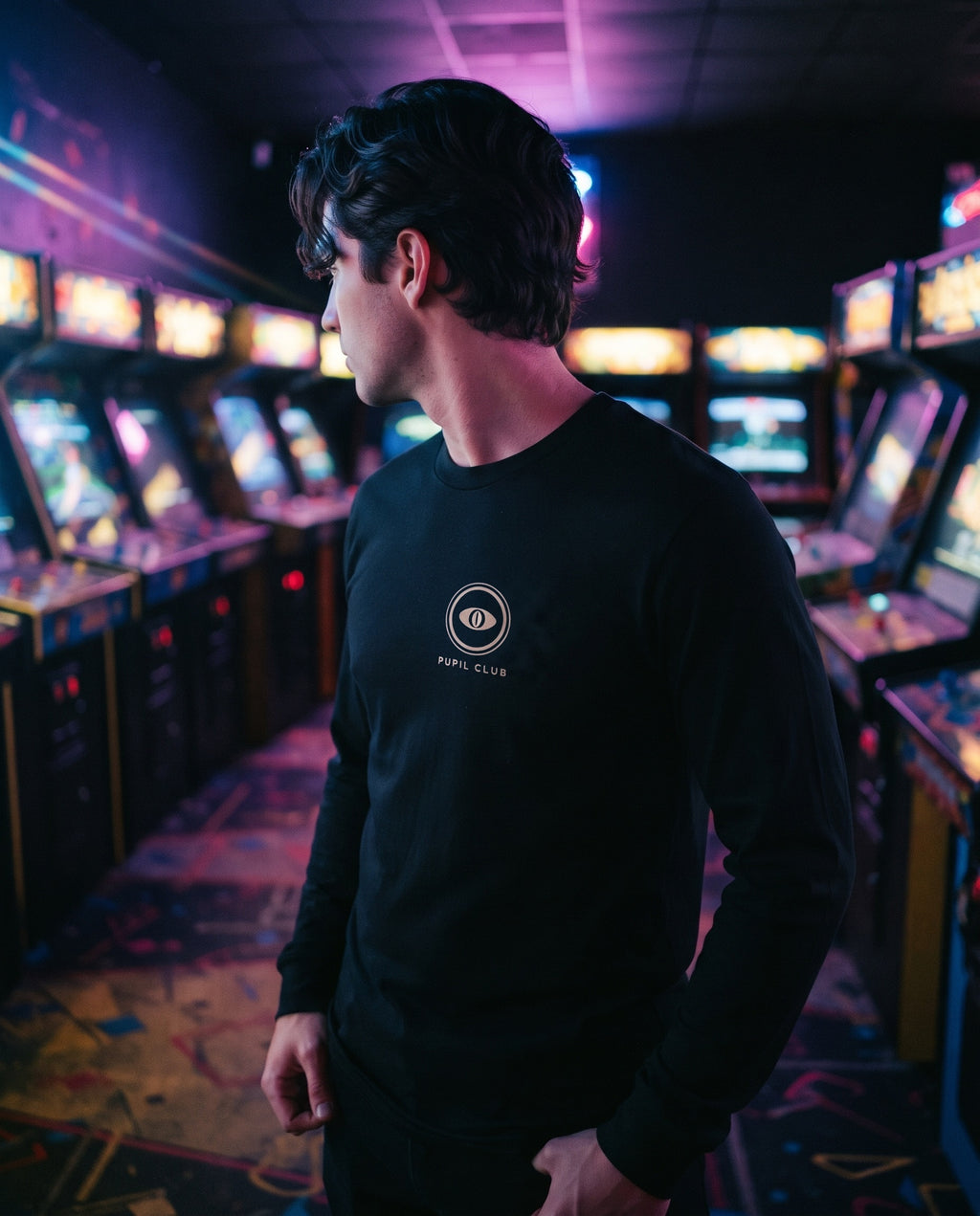 Final Form Long Sleeve front with the Pupil Club crest centered on the chest, in an arcade