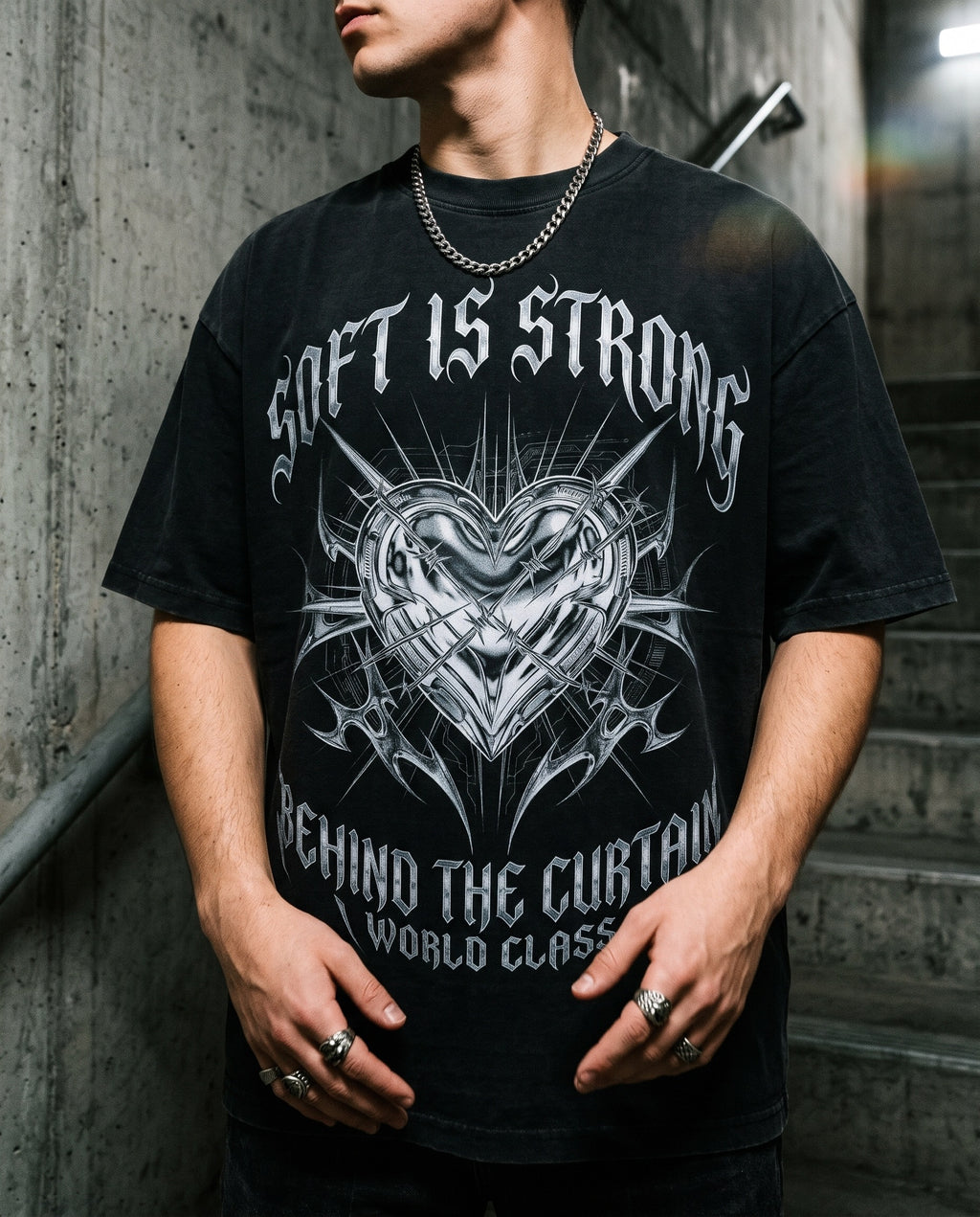 Metal Heart Tee worn in a concrete stairwell with a silver chain